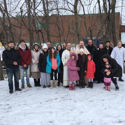 Parishioners and clergy of Our Lady of Pochaev gathered outdoors in winter